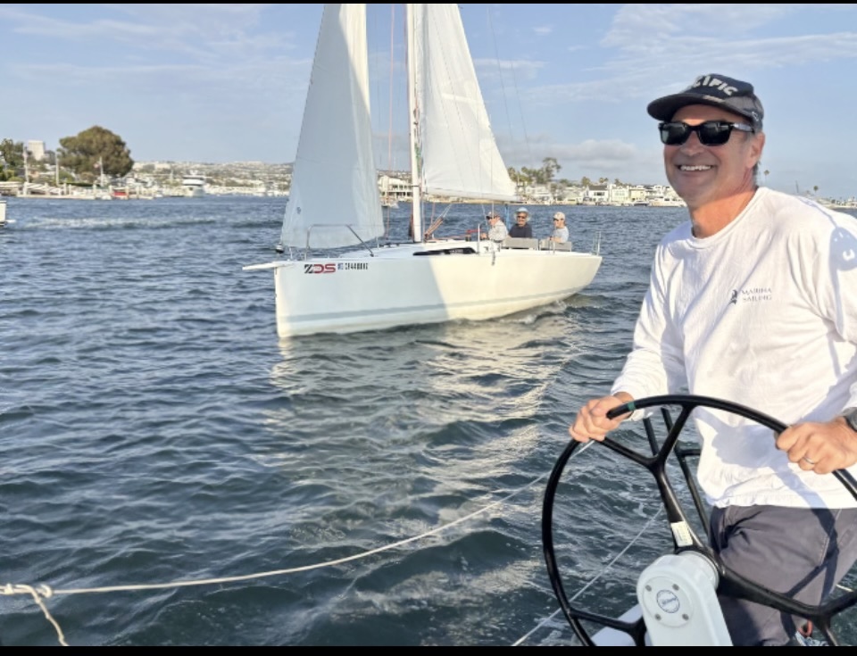 Michael Darr sailing at the helm